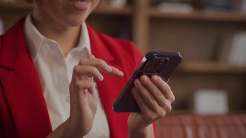 Businesswoman Interacting with Smartphone Screen