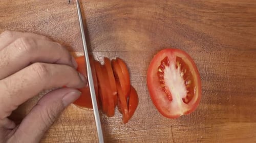 Tomato Sliced on Cutting Board for Food Preparation
