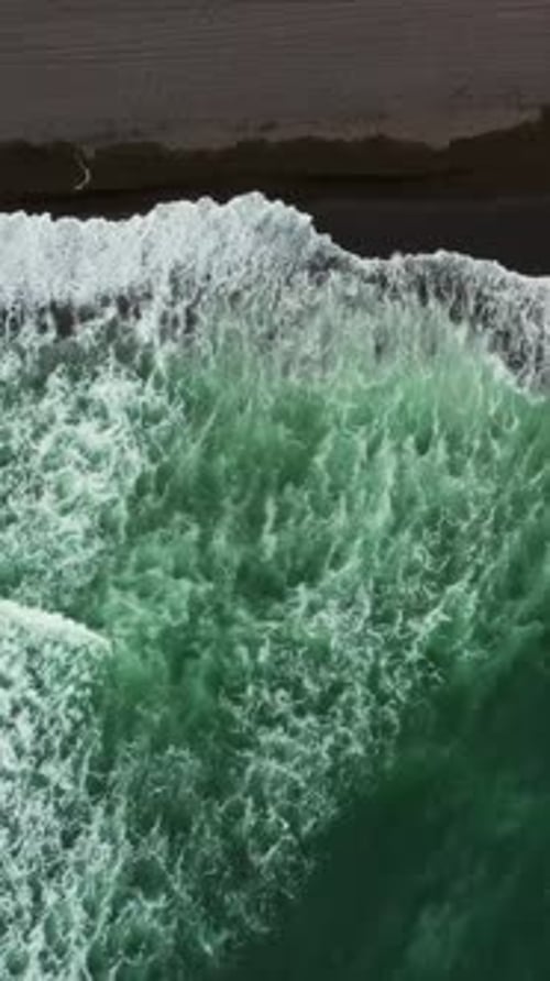Aerial Top View of Beach with Black Sand