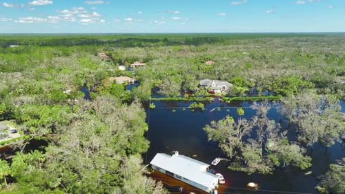 Surrounded By Hurricane Rainfall Flood Waters Homes in Florida Residential Area Consequences of