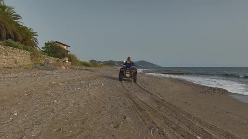 ATV Adventures Aerial of Girl on Mediterranean Shoreline