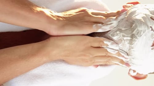 Man Applying Shaving Cream with Hands, Low Angle