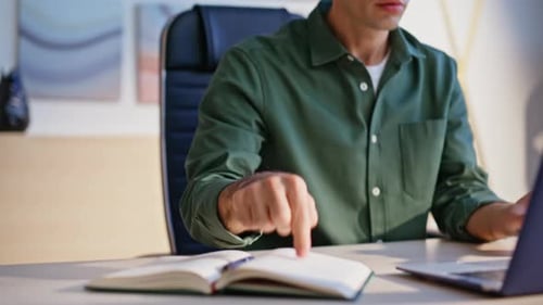 Furious Manager Quarreling Web Conference Pointing on Data in Notebook Closeup