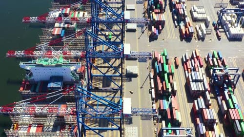 Container ship in export and import business and logistics delivery. Shipping cargo to harbor by cra