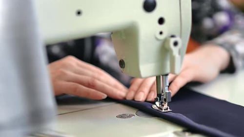 Female Seamstress Hands Sews Textile Clothes Use Electric Sewing Machine Tailoring Atelier Closeup