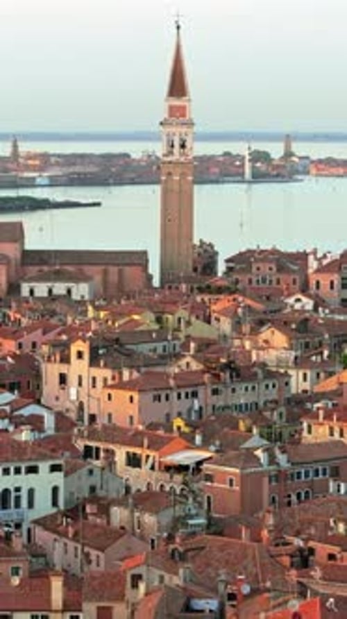 Aerial drone view of houses surrounding San Francesco della Vigna Campanile in Venice, Italy, at day