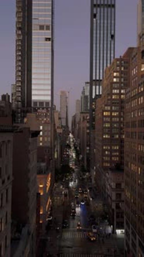 Vertical Video Showing a Fifth Avenue in Midtown Manhattan New York City with Yellow Taxi Cabs and