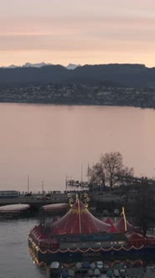 Aerial video of the city of Zurich and the lake at sunset