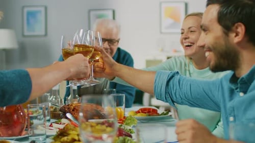 Family Celebrates Together at Dinner Table