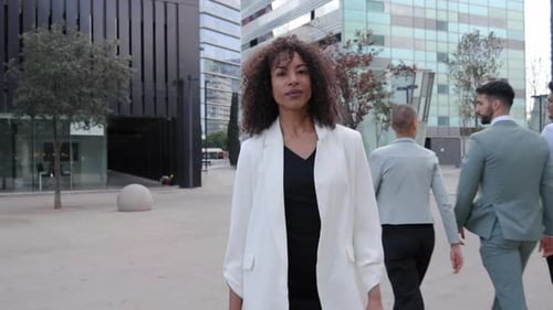 Confident African American Business Woman on Way to Office Crowded Coworkers Professional People