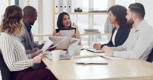4k video footage of a diverse group of businesspeople sitting and having a meeting in the office