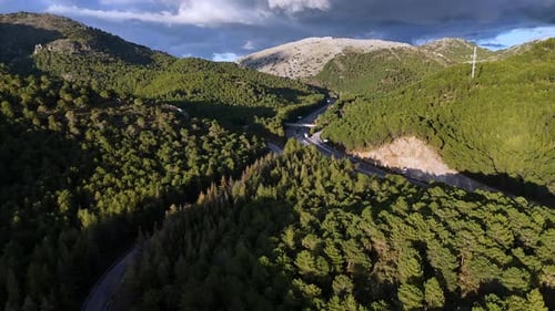 Serpentine Highway Through Verdant Mountains