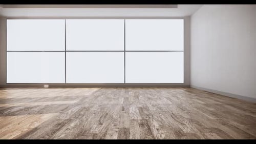 Geräumiges leeres Zimmer mit großen Fenstern und Holzboden