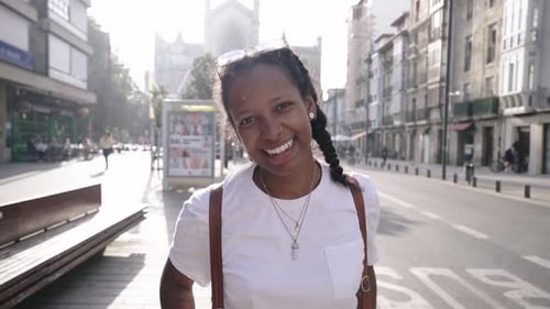 Portrait of Beautiful African American Woman Smiling at Camera Looking Confident at City Outdoors