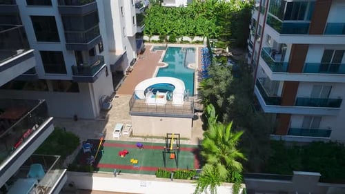 Aerial View Residential Complex With Stunning Pool and Water Slides By the Mediterranean Coast