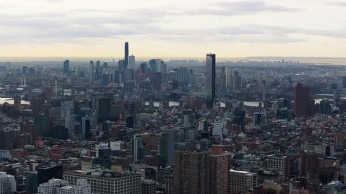 Camera Movement Showcases the New York City Skyline Highlighting Dense Urban Buildings and a Distant