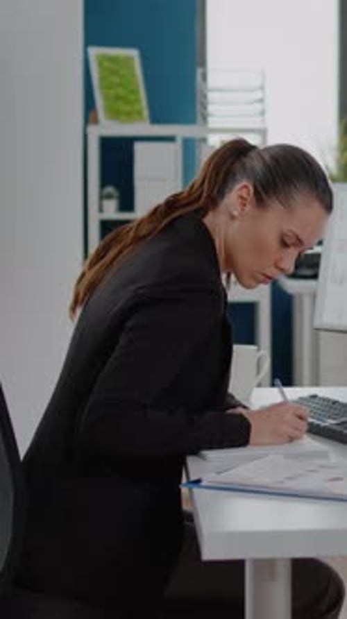 Young Woman Working at Computer in Modern Office