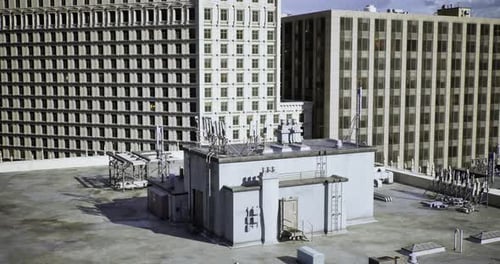 Roof Top View of Urban Buildings with Antennas and Structures in Daylight