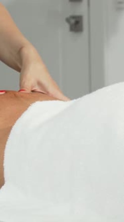 Woman Receives Relaxing Back Massage at a Spa