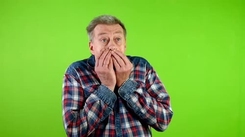 Man Reacts in Fear on a Green Screen
