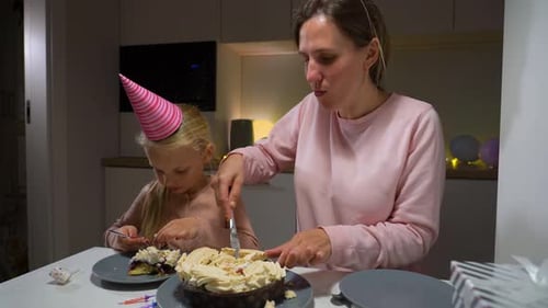 Family Celebrates Birthday with Cake