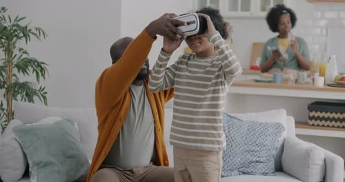 Father Gives His Son VR Headset in Living Room