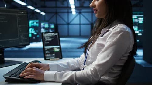 Close Up of IT Expert in Server Hub Establishing Performance Benchmarks