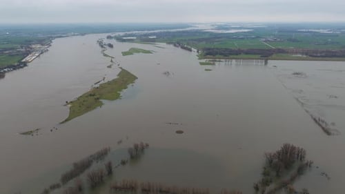 Wide angle aerial view of flooding around river Waal and Poederoijen. Aerial