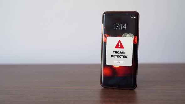 New trojan alert notification on the smart phone. Convept of virus ...