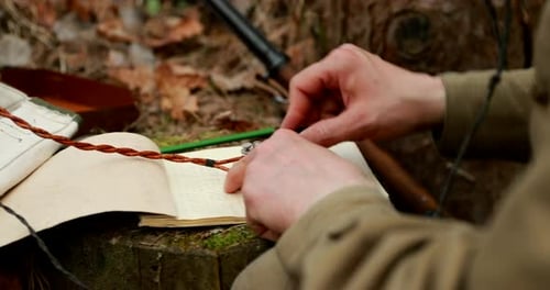 Man Operates Morse Code Keyer in Nature Setting