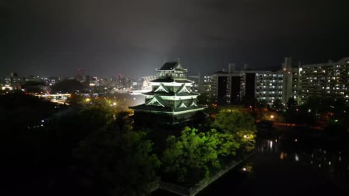 Aerial video of the Hiroshima skyline with Hiroshima Castle in Japan