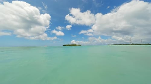 Flying Over the Water Surface in the Maldives