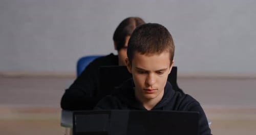 Teenagers School Students Working In Modern ComputerBased Classroom In School Education