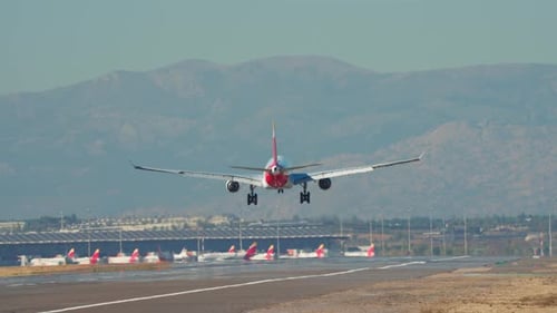 Passenger Airplane Landing on Airport Runway