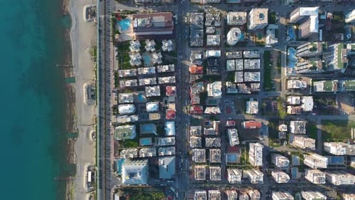 Aerial Video of Coastal Urban Area with Apartments and Wide Beach