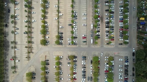 Aerial View of Cars Parked in Large Parking Lot