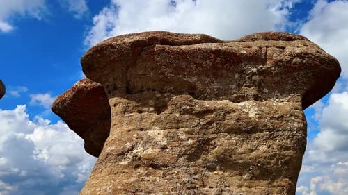 Rock formations under blue sky in Bucegi Mountains.