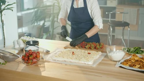 Closeup The Chef Prepares A Cake With Cream Nuts and Strawberries