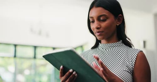 Creative, woman and thinking with tablet in office for research, proofreading and update draft