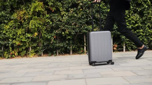 Tourist Man with Suitcase Baggage in Spain A Traveler with Luggage Suit Jacket on Business Street Go