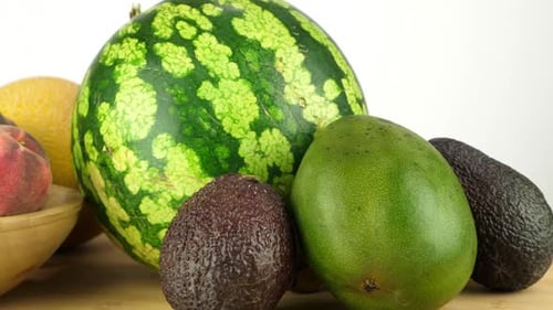 Assorted Fruits Watermelon, Cantaloupe, Peach, Avocado Close Up