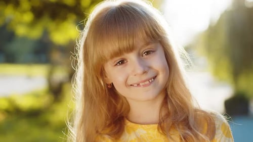 Portrait of Happy Preteen Child Girl Face Smiling Looking at Camera Good Mood Satisfied on Park