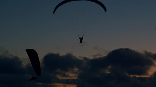 Paragliders at sunset_1