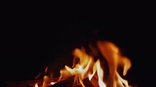 Close Up of Fireplace Flames Flickering in the Dark