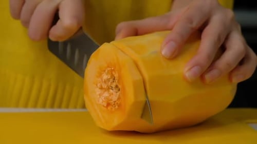 Woman Cook Cuts Pumpkin Into Small Pieces Pumpkin on a Wooden Board Ingredients for Cooking Pumpkin