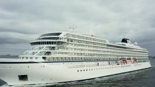 Aerial View of a Cruise Ship Sailing on the Ocean or Sea on a Cloudy Summer Day