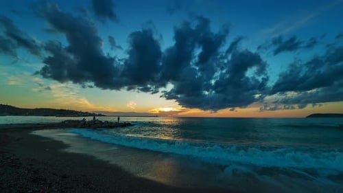 Sunset with Clouds Over Sea and Beach
