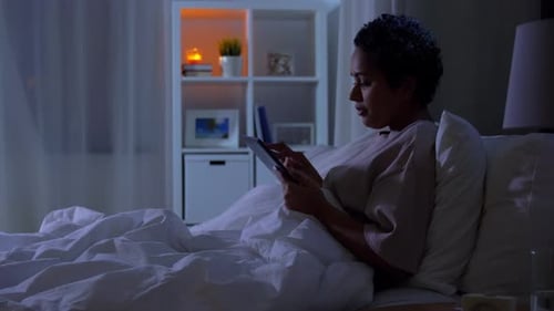 Technology, Internet and People Concept - Young African American Woman with Tablet