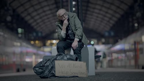 Elderly Homeless Man Suffering From Poverty Looking for Help at Train Station