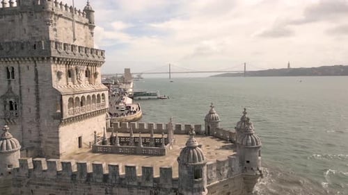 Aerial drone forward moving shot over Belem Tower, Torre de Belem landmark in Lisbon, capital of